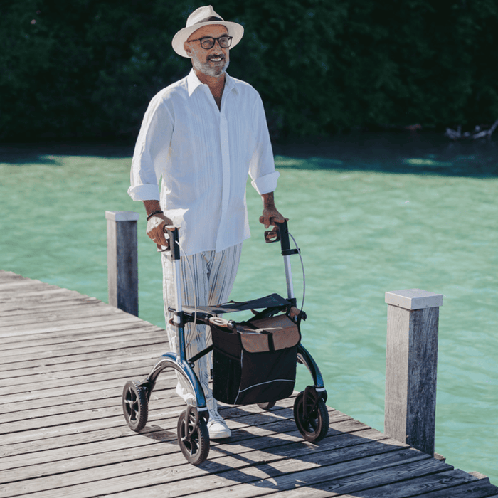 Rollator de Carbono Saljol Ultraligero – Andador Premium con Frenos Ajustables, Ruedas de 25 cm, Bolsa Extraíble y Reflectores – Tallas M y L – Hasta 150 kg
