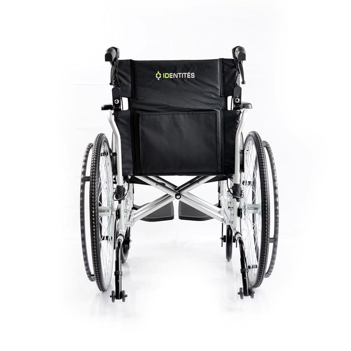 Silla de ruedas plegable con frenos de acompañante y ruedas antivuelco MouvLight