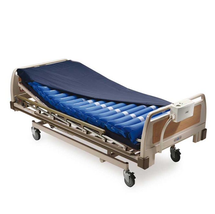 Colchón antiescaras con compresión regulable, mostrando su superficie y el compresor.